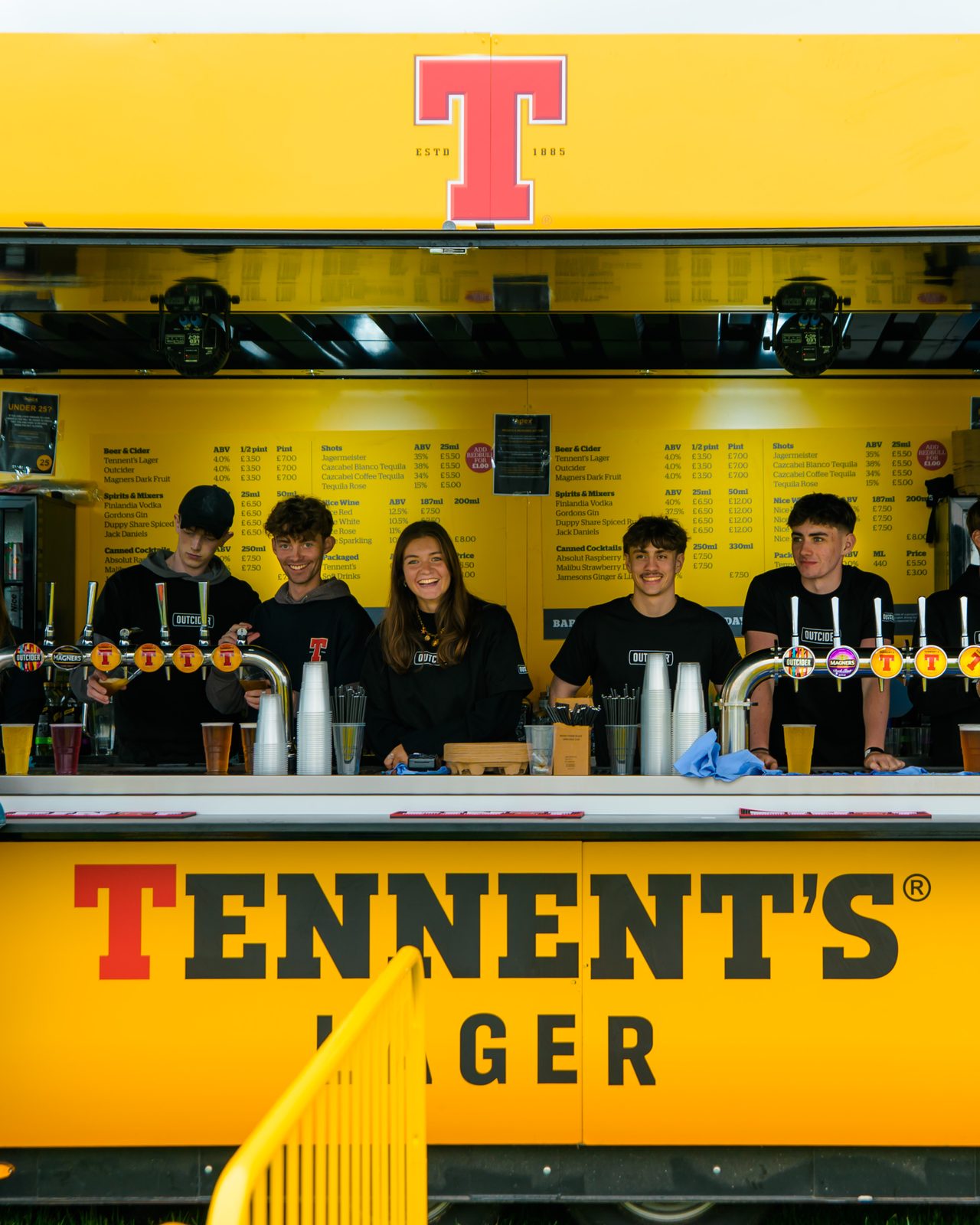 A 20ft unit fully wrapped in Tennent's yellow, team behind the bar