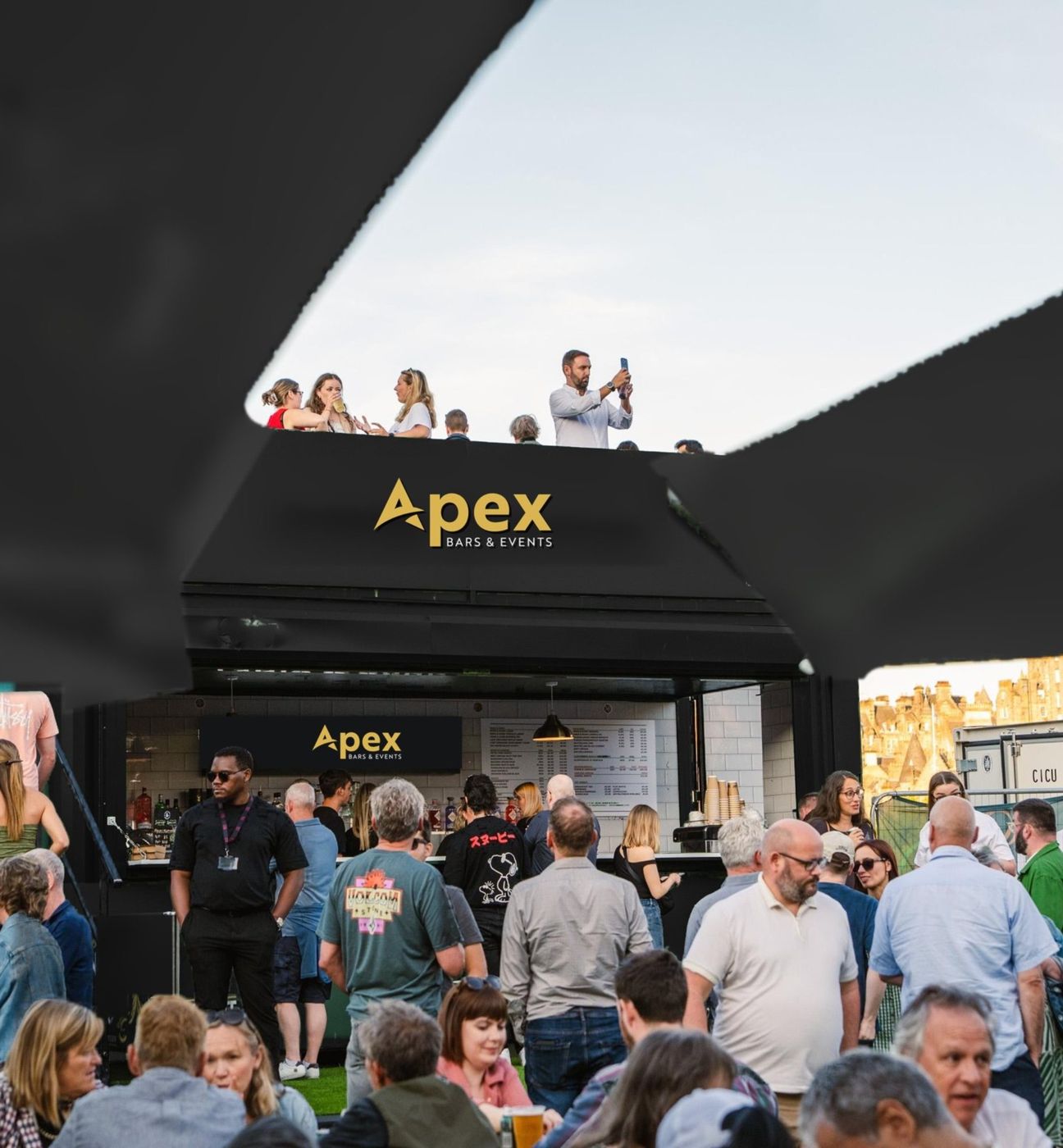 The Apex roof terrace bar with guests on the terrace above