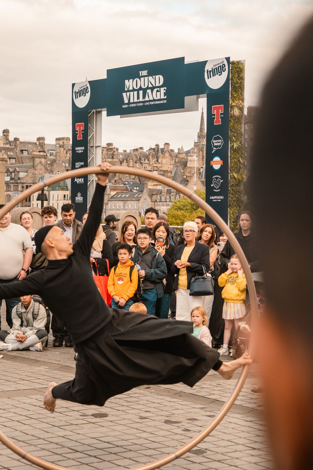 Street performer on a hoop at the Mound Village