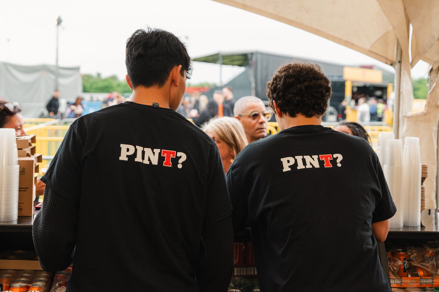 Branded Tennent's t-shirts at a fan zone bar